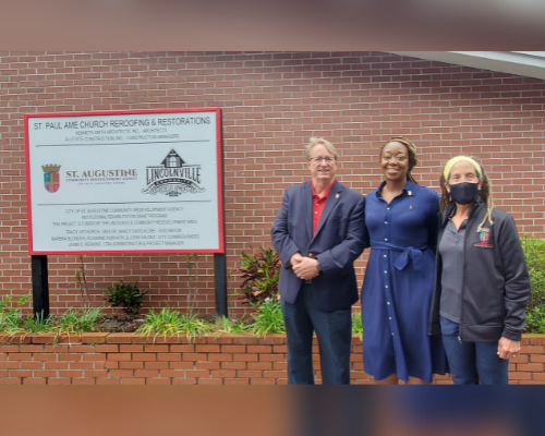 City staff and commissioner at institutional rehab project site
